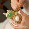 Colgante de huevo de jade dorado de Xinjiang con superficie de lujo con incrustaciones de jade Dongling Colgante de jade Regalo Joyería Venta al por mayor