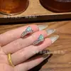 Venta al mayoreo del fabricante: Anillo de calabaza de agua azul natural del Libro Rojo, incrustación de plata S925, nuevo diseño de estilo chino