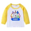 Camiseta infantil de primavera y otoño 2023, nueva camiseta de manga larga con cuello redondo y dibujos animados, camiseta de algodón para bebés y niños.