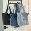 Bolsa de lona de mezclilla simple de gran capacidad, nuevo bolso de hombro casual Otoño 2026, bolso cruzado para axila para mujer