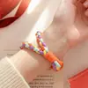 Correas de muñeca tejidas a mano de colores para teléfono de comercio exterior, disponibles en varios colores, llaveros, colgantes para bolsos y botellas de agua, venta al por mayor desde el fabricante