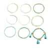 Pulsera apilada de cuentas de semillas con colgante de borla de cuentas bohemia más vendida transfronteriza con un diseño geométrico de alta gama