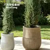 Maceta cilíndrica artística de hormigón UHPC hecha a medida con patrón circular multicapa y superficie decorativa tridimensional para áreas de exhibición de paisajes