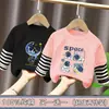 Camiseta de manga larga de algodón puro para niño, nuevo modelo primavera y otoño 2026, camiseta básica con estampado de dibujos animados para niño, top falso de dos piezas, moderno