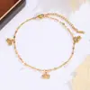 Tornozeleira única em aço inoxidável com design minimalista para mulheres, popular no comércio exterior, com um toque de luxo leve e de alta qualidade, apresentando um pingente de estrela de cinco pontas e borboleta