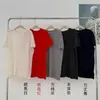 Estilo de Fila sin Costuras de una Sola Pieza 100% Lana Cuello Redondo Manga Corta Longitud Media Camiseta Top de Punto Rizada Aspecto Holgado Adelgazante