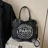 Bolsa de Lona Casual de Grande Capacidade para Mulheres 2026 Nova Moda Bolsa de Ombro Transversal para o Dia a Dia Bolsa Tote de Mão com Cor Contrastante