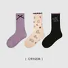 Calcetines para Niños al Mayoreo Otoño e Invierno 2025 Nuevos Negro y Blanco Lazo Niñas Media Pantorrilla Algodón Oreja Sin Hueso Calcetines para Niños