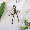 Nudo de Corazón Creativo Nuevo Estilo Miu Lanyard Versátil Llavero Colgante para Bolsas y Fundas de Teléfono
