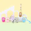 Bolsa de monedas de silicona de dibujos animados al por mayor, llavero colgante, funda para auriculares, mini bolsa de almacenamiento, muñeco llavero bolsa colgante