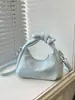 Bolsa de Mão Pequena Tendência Estilo Coreano Atacado Transfronteiriço para Mulheres 2026 Nova Moda Bolsa Meia-Lua com Laço Bolsa de Ombro Único Transversal