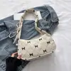 Bolsa Versátil de Veludo com Laço Feminina 2026 Nova Bolsa de Ombro Único para o Trabalho Nicho Alta Aparência Grande Capacidade Bolsa de Mão