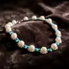 Conjunto de Pérolas Azuis de Pedra Azul Estilo Palácio Vintage Retro de Qingdao, Conjunto de Duas Peças de Colar e Brincos de Luxo Leve de Alta Qualidade