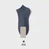 Calcetines blancos y negros para hombres y mujeres, calcetines de media pantorrilla para primavera y otoño, calcetines de algodón transpirables de color liso, calcetines deportivos para parejas, calcetines cortos de verano al por mayor
