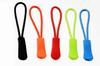 Los fabricantes suministran cuerdas de tracción semicirculares de TPU de color luminoso para ropa, equipaje, cremallera, asa, pieza de tracción, lazo de tracción.