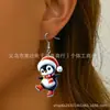 Pendientes Navideños Lindos de Venta Caliente Transfronterizos Estilo Dibujos Animados con Gorros Rojos Navideños, Bufandas y Adornos Navideños de Pingüino para Orejas