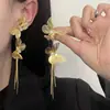 Pendientes de Borla de Metal con Diamantes de Mariposa Super Brillantes Europeos y Americanos Tendencia de Moda Lujo Ligero Alto Sentido Joyería para Orejas Versátil Mujer