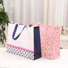 Bolsa de Almacenamiento de Ropa Estampada Versión Horizontal Bolsa No Tejida Portátil Viaje Bolsa de Embalaje de Ropa Venta al por Mayor Gran Capacidad