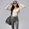 Conjunto deportivo de yoga de secado rápido para mujer, con un top de manga larga protector del sol y pantalones deportivos elásticos y transpirables, un atuendo versátil para el día a día