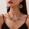 Collar elástico de diseño de nicho de venta caliente transfronterizo, circular hueco geométrico, metal vintage europeo y americano, venta al por mayor desde el fabricante