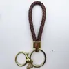 Venta al por mayor del fabricante Llavero de Cuerda de Aleación Tejida y Cuero Accesorios Colgantes Material PU Bolsas Pequeñas de Regalo Accesorios para Llaveros