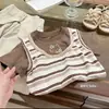 Ropa infantil coreana de capas para niñas, nuevo modelo de verano, camiseta de imitación de dos piezas con mangas cortas a rayas y conjunto de dos piezas con pantalones elegantes