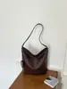 Bolso de cubo de nicho de alta gama transfronterizo para mujer, nuevo, textura tejida retro, bolso de hombro único para debajo del brazo, bolso de mano para ir al trabajo