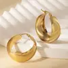 Aretes de acero de titanio del fabricante, aretes grandes de aro de acero inoxidable exagerados, diseño geométrico liso hueco, populares en Europa y América, aretes de nicho