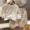 Sudadera de primavera estilo coreano a rayas conjunto de algodón puro a rayas moda para niños otoño primavera pantalones de trabajo para niños conjunto de tres piezas