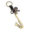 Colgante de Saxofón de Instrumento Musical de Aleación Retro Accesorio para Mochila Nuevo Popular Llavero Sencillo de Cuero Tejido