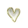 Exquisitos botones irregulares en forma de corazón con recubrimiento de aceite para cárdigans de punto, suéteres, y botones metálicos para camisas y vestidos