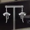 Qian Jin BalletAretes Largos con Borla y LazoPinzas de Mosquitero Sin Perforación Exquisitos Pendientes Accesorios para Orejas para Mujeres