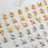 Acero inoxidable y acero de titanio transfronterizo más vendido 26 colgantes de letras inglesas accesorios DIY colgante perforado tridimensional joyería