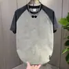 2026 Nuevo Estilo de Verano Camiseta de Manga Corta con Bloques de Color para Hombre Marca de Moda Holgada Cuello Redondo Casual Diseño de Empalme Superior para Hombre