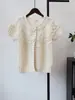 Cardigan de tricô de manga curta com flores tridimensionais, novo estilo para o início do outono de 2026, suéter de outer wear em camadas solto, estilo coreano para mulheres