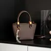 Transfronterizo 2025 Nuevo Retro Coreano Nicho Diseño de Alta Gama Moda Bolso Cruzado de Hombro de Mano Tipo Cubo para Mujeres