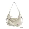 Bolsa de Ombro Único Feminina 2026 Nova Retro Rebite Formato de Estrela Bolsa Feminina Moda Sensação de Alto Padrão Grande Capacidade Bolsa de Axila Transfronteiriça
