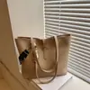 Bolso de hombro tipo tote de gran capacidad para el trabajo, nueva tendencia casual de primavera 2026, bolso de hombro diario texturizado para mujer