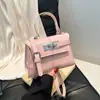 Bolso bandolera de diseño nicho de comercio exterior para mujer, bolso pequeño cuadrado, nuevo popular 2026, bolso Kelly, bolso de un solo hombro moderno y de moda