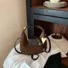 Bolso de luna de moda para mujer, bolso cruzado versátil vintage, bolso de mano ligero de nicho para ir al trabajo y uso diario