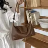 Bolso de axila de rayas de color sólido transfronterizo de nicho para mujer, nuevo bolso cruzado versátil, bolso de cuerno retro, bolso de un solo hombro para el trabajo