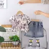 2026 Nueva Moda Verano Niños Ropa de Manga Corta Ropa Infantil Tie-Dye Estampado Completo Inglés Cuello Redondo Con Capucha Conjunto de Dos Piezas Moderno