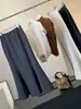 Saia de terno simples estilo sereia para mulheres, novo estilo outono, cintura alta, fluida, que cobre o quadril, elegante, justa ao corpo, saia de comprimento médio para o trabalho