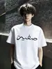 Top de verano para hombre de estilo simple, exclusivo transfronterizo, bordado, de manga corta, con mangas acanaladas tridimensionales en los hombros y cuello pequeño