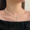Collar de perlas de doble capa estilo retro francés para mujer, ligero, lujoso, de alta gama, con cadena para el cuello.