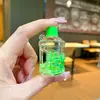 Botella Creativa de Acrílico con Aceite y Arena Movediza, Taza Luminosa, Colgante para Llavero, Accesorios para Coche, Adornos de Escritorio