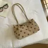 Bolso japonés textura simple bolso de hombro individual coreano gran capacidad 2026 nuevo otoño gamuza axila exquisito