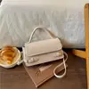 Bolso pequeño cuadrado de diseño nicho transfronterizo, bolso de mano de hombro de moda para mujer, bolso cruzado versátil y elegante