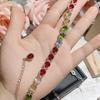 Pulsera de tesoro de color turmalina completamente transparente de venta caliente transfronteriza Camellia para mujer, chapada en 18K, brillante, con diamantes completos, pulsera de cristal de colores