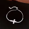 Pulsera de cordón con colgante de cruz de circonita, sensación de lujo ligero de alta gama, diseño de nicho a la moda, accesorio de mano único